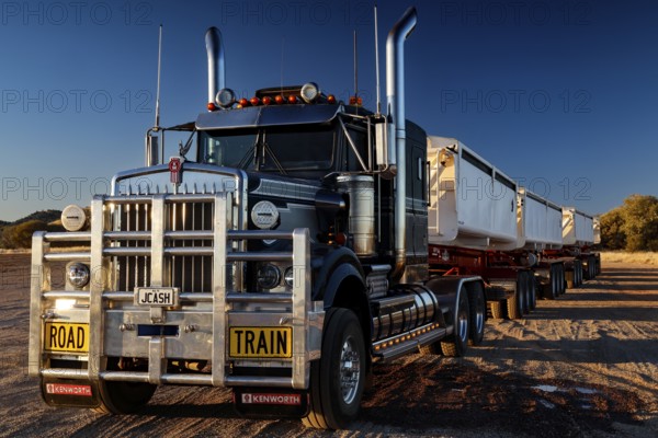 Large road train on Stuart Highway under clear skies, zero