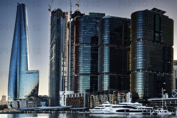 Futuristic skyscrapers in Sydney's Barangaroo are reflected in the water, Sydney, New South Wales,