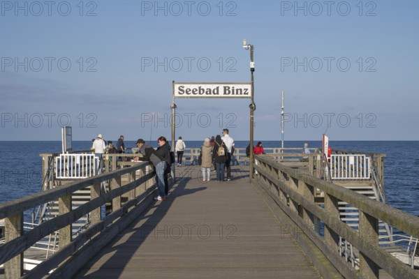 Tourists on the pier, sign Seebad Binz, Binz, seaside resort, Rügen island, Baltic Sea,