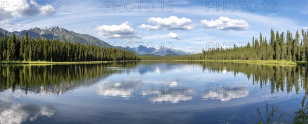Mountains are reflected in idyllic Crystal Lake, McCarthy Highway, Wrangell St. Elias National