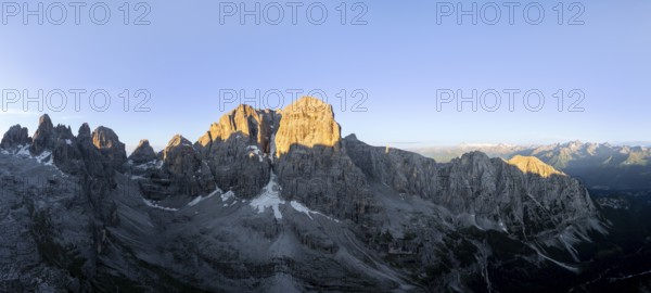Aerial view, alpine panorama, Cima Tosa and rocky peaks at sunrise with alpine glow, picturesque