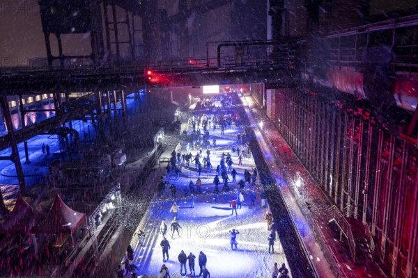 Ice rink at the Zollverein coking plant, ice skating with music and many lighting effects, Essen,