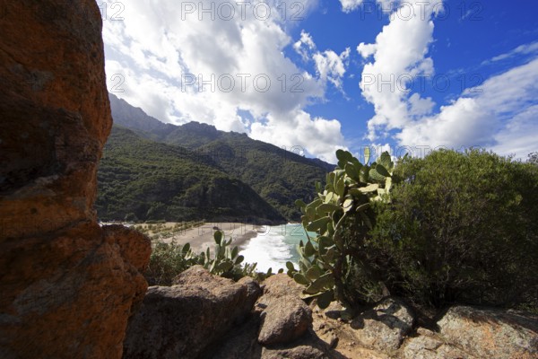 View of the pebble beach and Porto Bay, a UNESCO World Heritage Site, Ota, west coast of Corsica,
