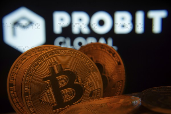 Dhaka, Bangladesh- 27 Mar 2025: Close-up of Bitcoin coins with the ProBit Global logo visible on a