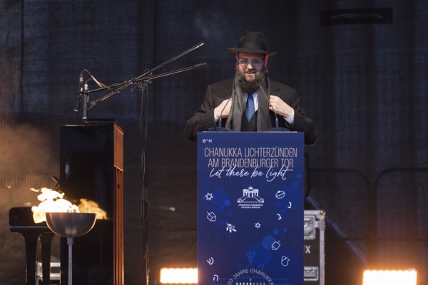 Yehuda Teichtal (Rabbi of the Chabad-Lubavitch movement) speaks at the lighting of lights to mark