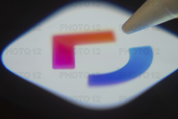 Dhaka, Bangladesh- 06 Dec 2025: Close-up of the ClickUp app on a screen with a stylus pointing at
