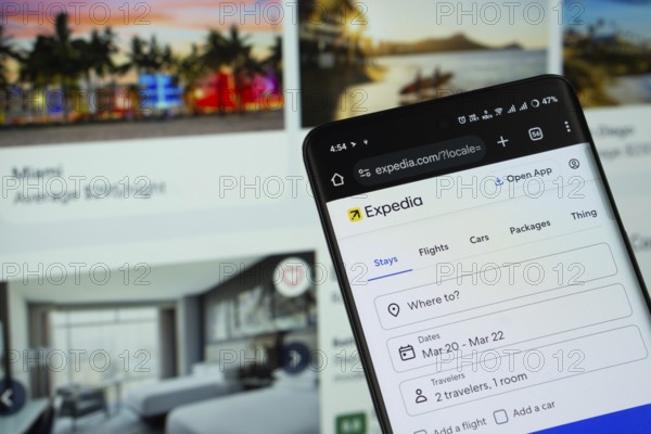 Dhaka, Bangladesh- 11 March 2025: Expedia logo is seen on a smartphone, with the website visible on