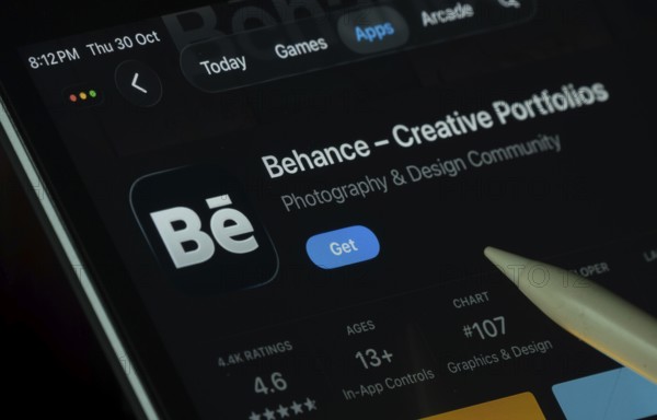 Dhaka, Bangladesh- 30 Oct 2025: Behance app displayed on a iPad screen in dark mode with a digital
