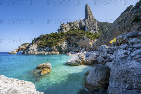 Light blue clear sea on a dream beach on Cala Goloritzé, picturesque rocky coast, steep coast with