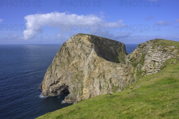 View of blue sea and cliffs with rock gate from Portacloy Loop Cliff Walk, Muingnabo, County Mayo,