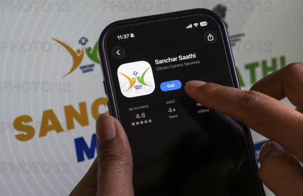 In this photo illustration, a person downloads the Sanchar Saathi mobile application on an iPhone,