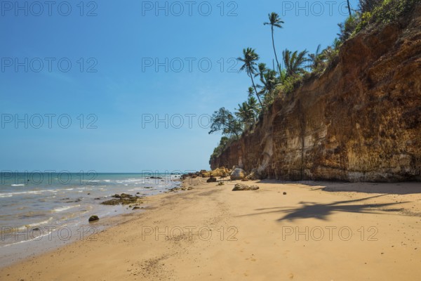 Lonely beach with red rocks and coconut trees, Red Cliffs, Bang Saphan Noi, Prachuap Khiri Khan