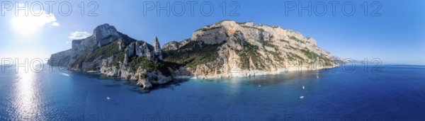 Panorama, picturesque rocky coast, cliffs with L'Aguglia pinnacle, blue sea and Cala Goloritzé