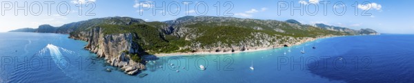 Picturesque rocky coast, cliffs and Cala Luna beach, aerial view, Golfo di Orosei, Baunei,