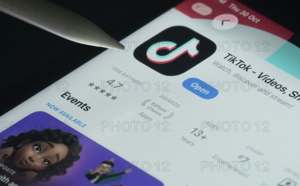 Dhaka, Bangladesh- 30 Oct 2025: TikTok app on a iPad screen with a pen pointing at the install