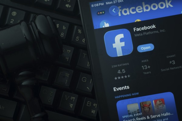 Dhaka, Bangladesh- 28 Oct 2025: An iPad displaying the Facebook app against a judge's gavel and