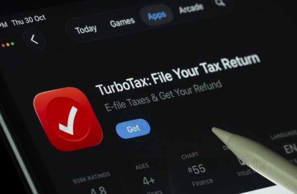 Dhaka, Bangladesh- 30 Oct 2025: TurboTax app displayed on a iPad screen in dark mode with a digital