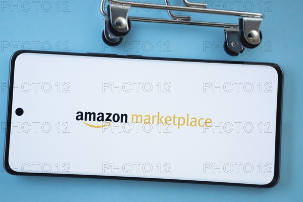 Dhaka, Bangladesh- 21 Nov 2025: Smartphone screen showing the amazon marketplace logo with shopping