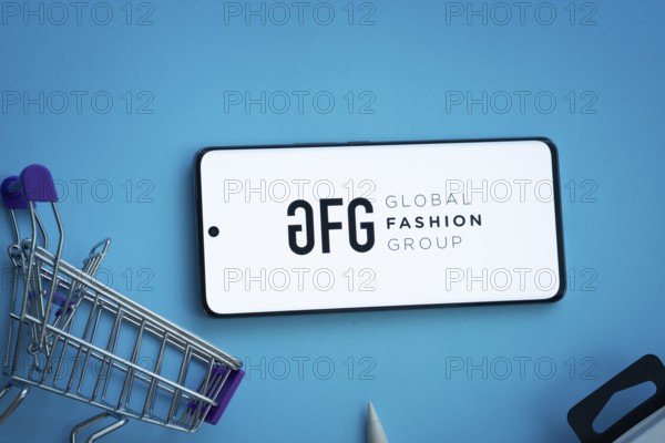 Dhaka, Bangladesh- 21 Nov 2025: Smartphone displaying Global Fashion Group logo with shopping cart