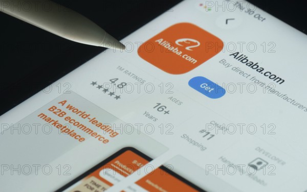 Dhaka, Bangladesh- 21 Nov 2025: Alibaba.com app on a iPad screen with a pen pointing at the install