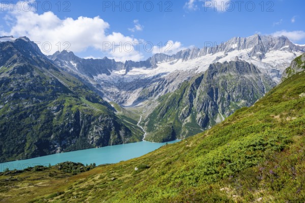 Turquoise blue mountain lake Göscheneralpsee, picturesque mountain landscape with dammastock and