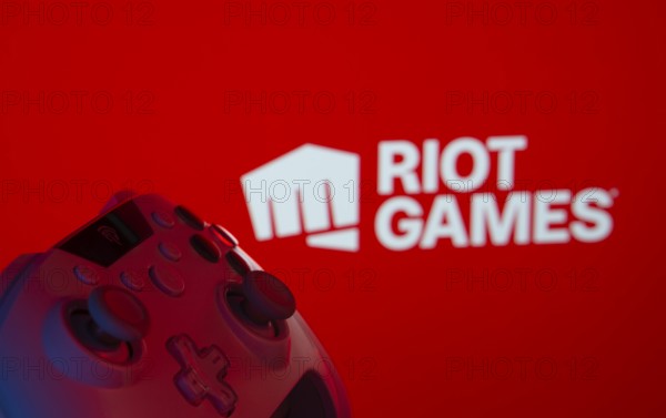 Dhaka, Bangladesh- 14 Nov 2025: A close-up of a gamepad with the Riot Games seen on screen in the
