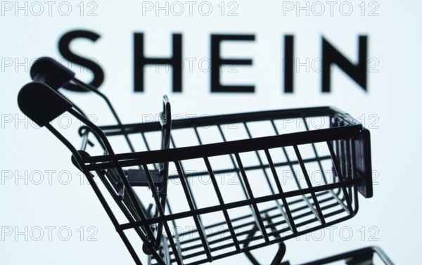 Dhaka, Bangladesh- 03 July 2025: Silhouette of a shopping cart in front of the SHEIN logo,