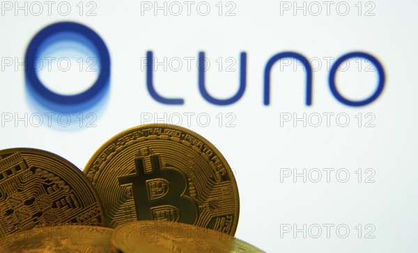Dhaka, Bangladesh- 03 Sep 2025: Close-up of Bitcoin coins with the Luno logo visible on a screen in