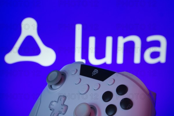 Dhaka, Bangladesh- 14 Nov 2025: A close-up of a gamepad with the Amazon Luna seen on screen in the