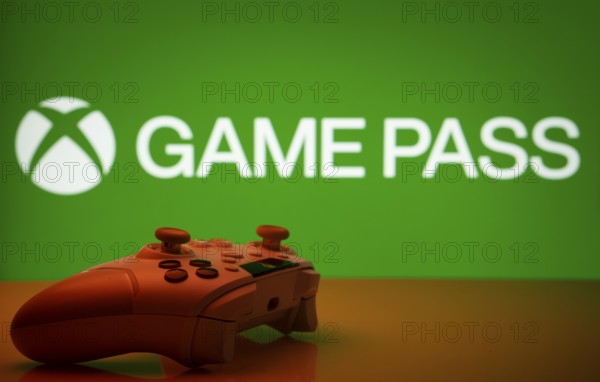 Dhaka, Bangladesh- 19 Sep 2025: A close-up of a white gamepad with the Xbox Game Pass seen on