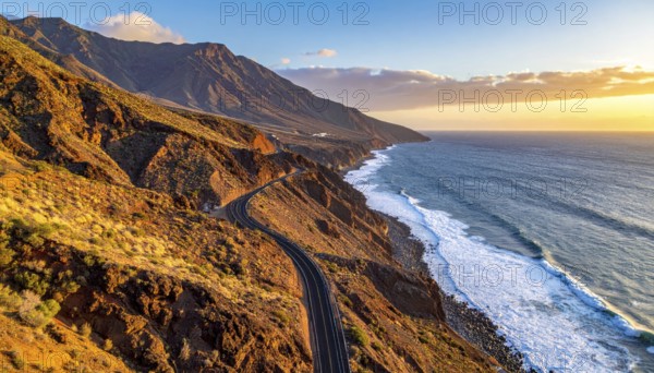 Desert landscape converges with ocean along a rugged coastal area, shore break at cliffs, blue