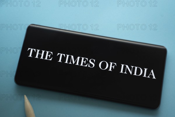 Dhaka, Bangladesh - 18 March 2025: The logo of the times of india is displayed on a smartphone