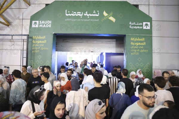Saudi companies showcase products and investments inside the Saudi pavilion at the Damascus
