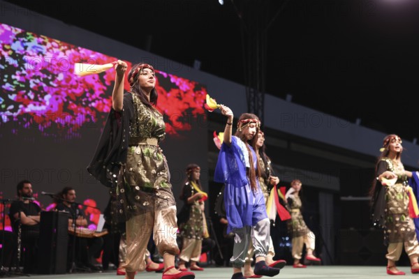 A Kurdish traditional dance troupe performs during the Damascus International Fair, the first