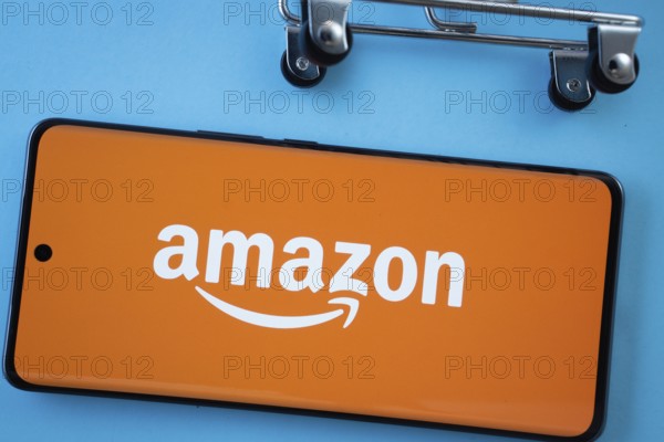 Dhaka, Bangladesh- 03 July 2025: Smartphone screen showing the Amazon logo with shopping cart
