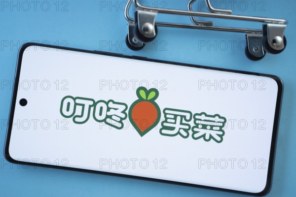 Dhaka, Bangladesh- 03 July 2025: Smartphone screen showing the Dingdong Maicai logo with shopping