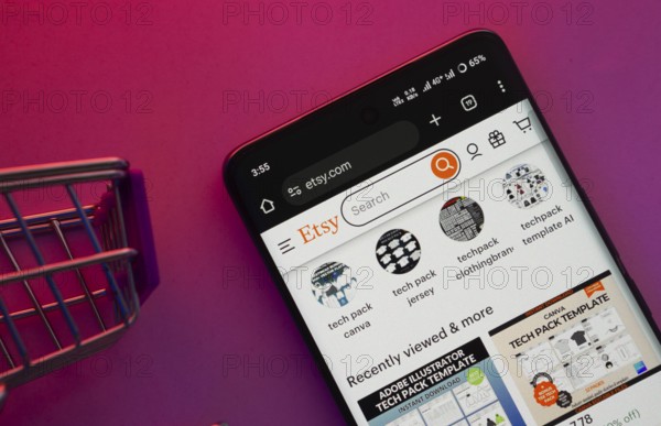 Dhaka, Bangladesh- 23 June 2025: A smartphone displaying the Etsy website with a shopping cart is