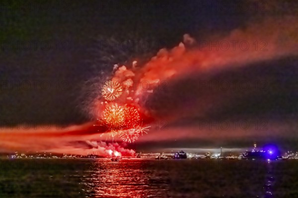 Lake Night Festival Constance. Water fireworks over the German shore and the neighbouring Swiss