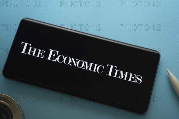 Dhaka, Bangladesh - 18 March 2025: The logo of The Economic Times is displayed on a smartphone
