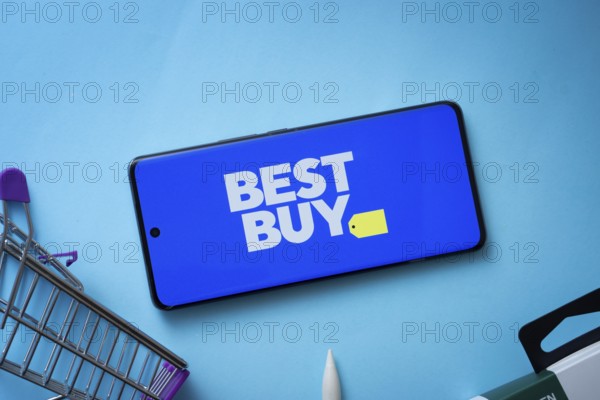 Dhaka, Bangladesh- 03 July 2025: Smartphone displaying Best Buy logo with shopping cart on a blue