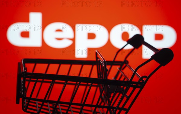 Dhaka, Bangladesh- 03 July 2025: Silhouette of a shopping cart in front of the Depop logo,