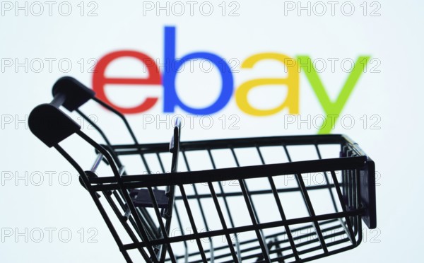 Dhaka, Bangladesh- 03 July 2025: Silhouette of a shopping cart in front of the eBay logo,