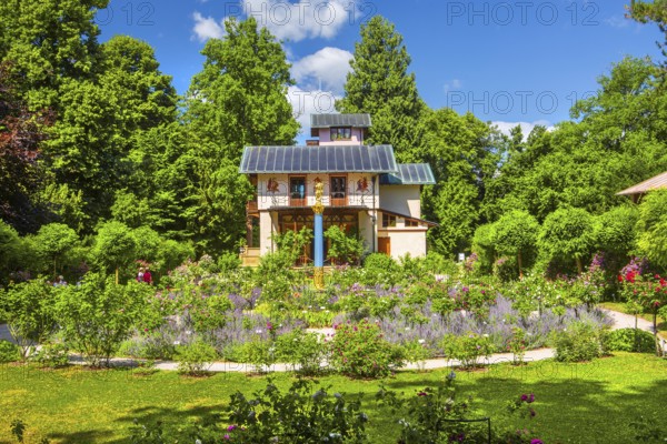Rosarium with blooming roses in front of the Pompeian-Bavarian Casino on the Rose Island in Lake