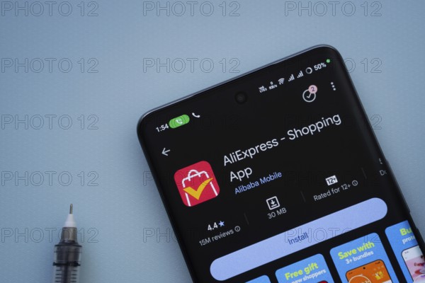 Dhaka, Bangladesh- 29 May 2025: On a blue surface, a smartphone displays the AliExpress app within