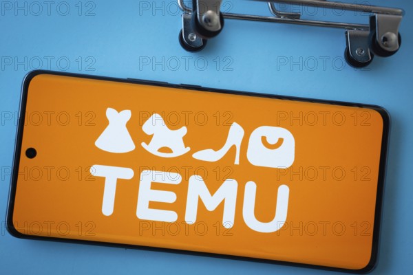 Dhaka, Bangladesh- 03 July 2025: Smartphone screen showing the Temu logo with shopping cart wheels
