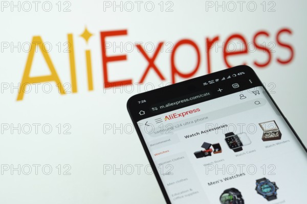 Dhaka, Bangladesh- 03 July 2025: Smartphone displaying AliExpress web interface against AliExpress