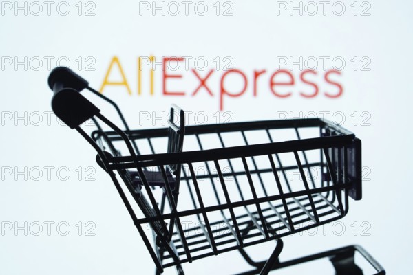 Dhaka, Bangladesh- 03 July 2025: Silhouette of a shopping cart in front of the AliExpress logo,
