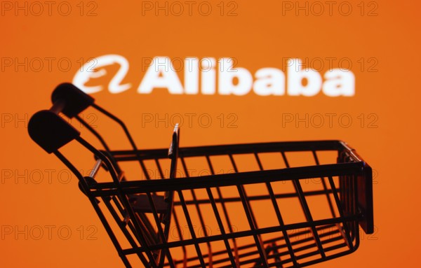 Dhaka, Bangladesh- 03 July 2025: Silhouette of a shopping cart in front of the Alibaba logo,