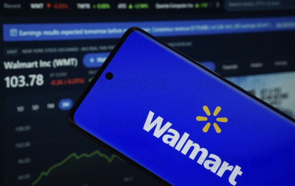 Dhaka, Bangladesh- 15 July 2025: Walmart logo is displayed on a smartphone screen, with a stock