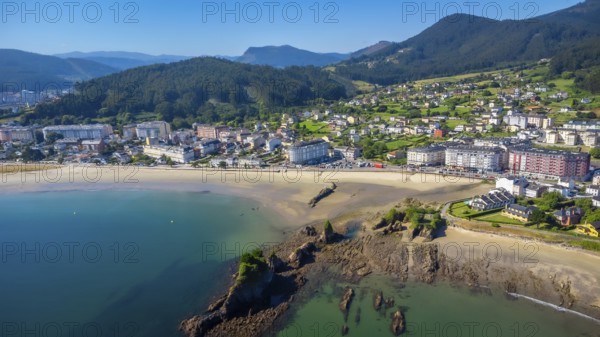 Aerial view of covas beach meeting the charming town of viveiro, nestled amidst the stunning